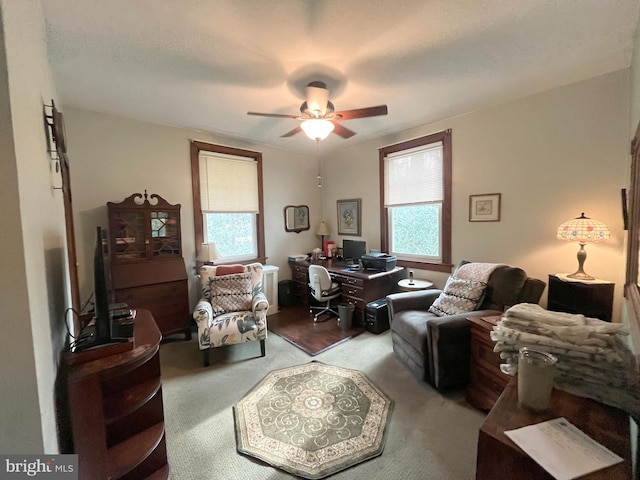 interior space with ceiling fan