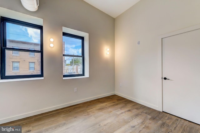 empty room with light hardwood / wood-style flooring