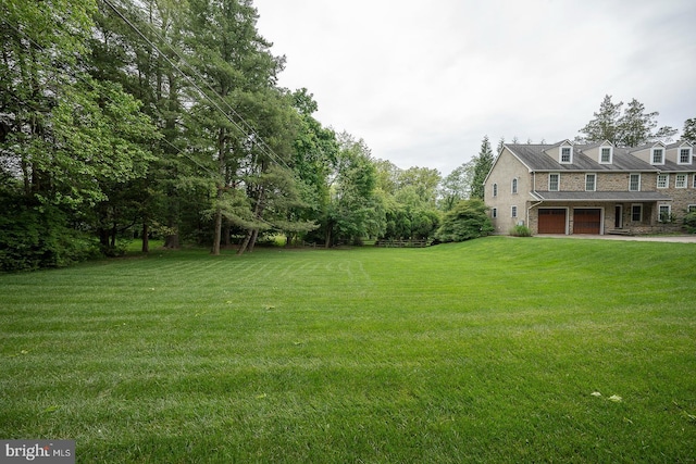 view of yard with a garage