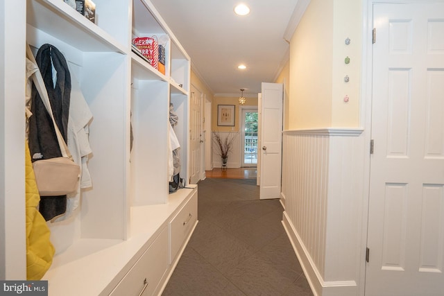 mudroom featuring a wainscoted wall, ornamental molding, and recessed lighting