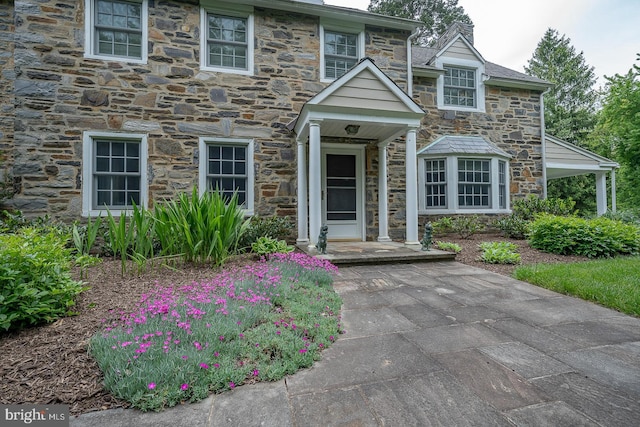 view of front of home with stone siding