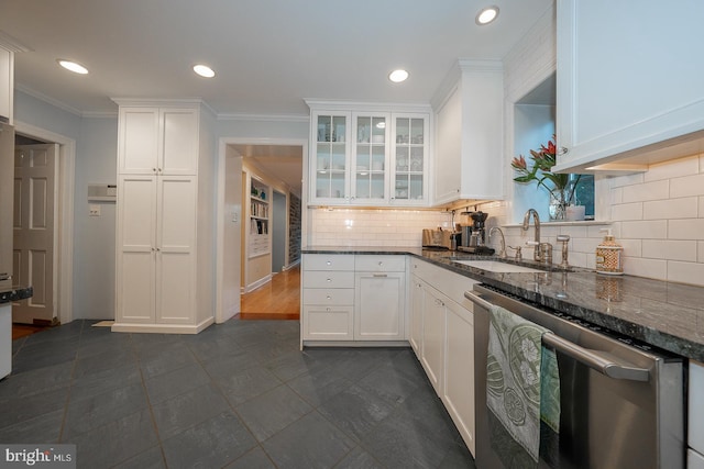 kitchen featuring glass insert cabinets, dark stone counters, white cabinets, and stainless steel dishwasher