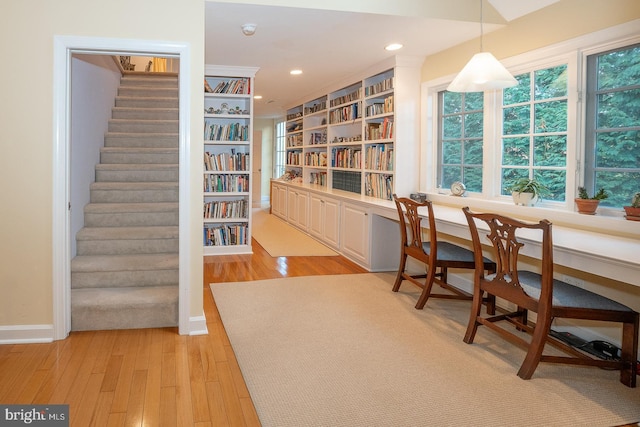 interior space featuring recessed lighting, light wood finished floors, and stairs