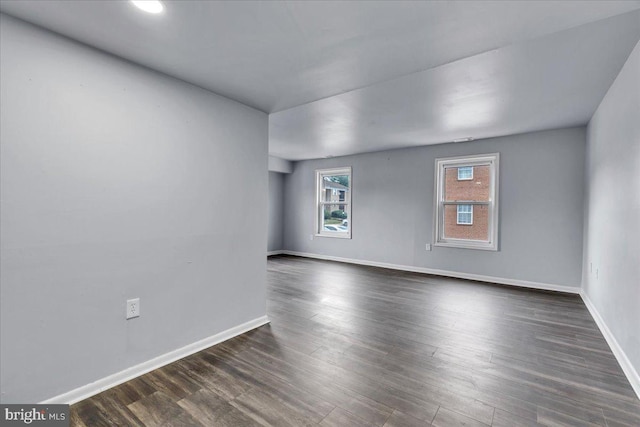 empty room featuring dark hardwood / wood-style floors