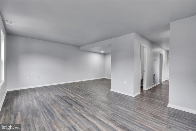 empty room featuring dark wood-type flooring