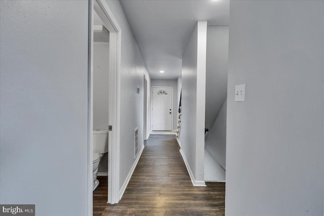 hallway with dark wood-type flooring