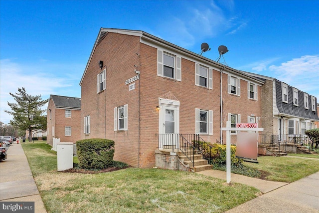 view of front of property with a front lawn