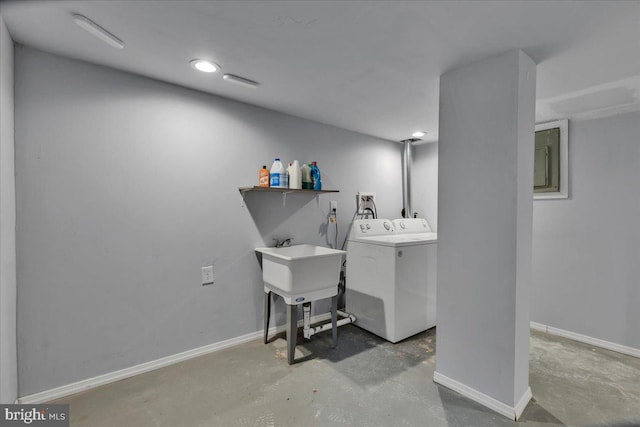 laundry room with washing machine and dryer and sink