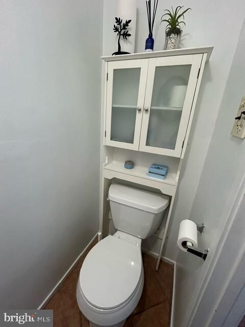 bathroom featuring tile patterned flooring and toilet