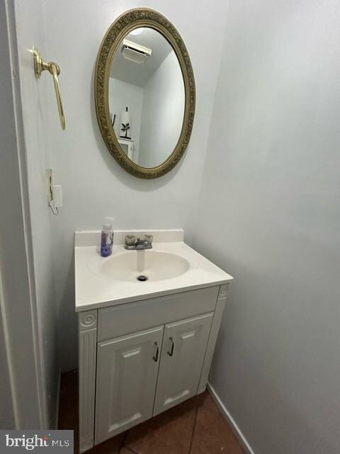 bathroom featuring tile patterned floors and vanity