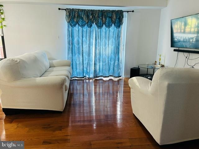 living room with dark hardwood / wood-style floors