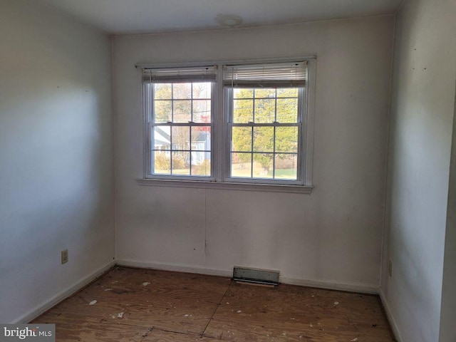 empty room featuring hardwood / wood-style flooring