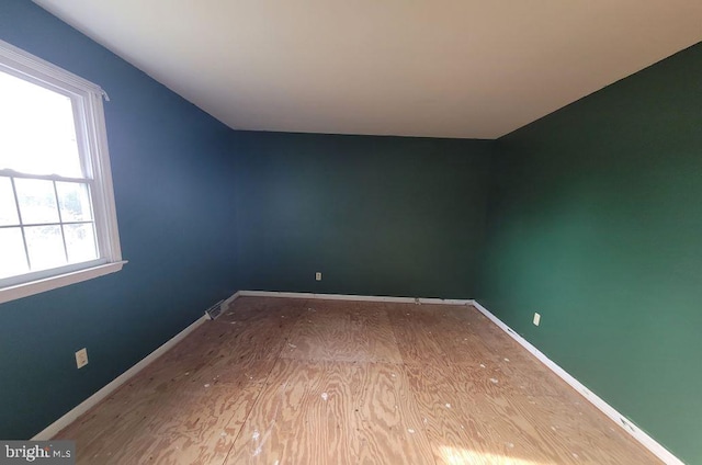 unfurnished room with light wood-type flooring