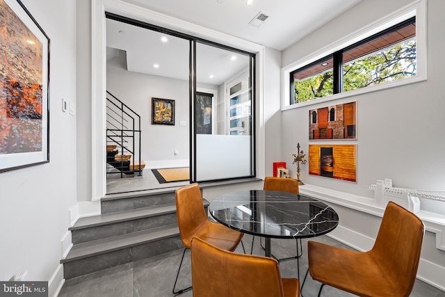 dining room with stairway, baseboards, visible vents, and recessed lighting