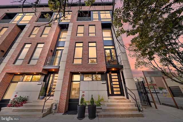 view of property at dusk