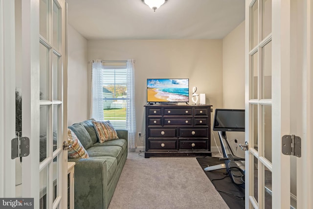 carpeted office featuring french doors