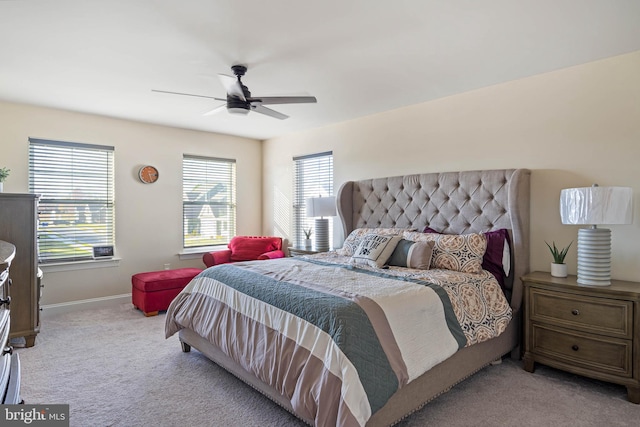 bedroom featuring light carpet and ceiling fan