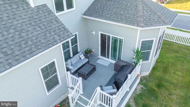 back of house featuring a deck, an outdoor hangout area, and a yard