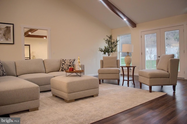 living room featuring hardwood / wood-style flooring, vaulted ceiling with beams, and french doors