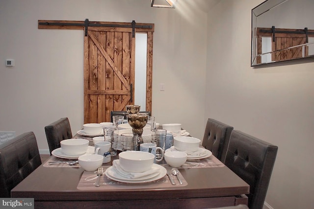 dining room with a barn door