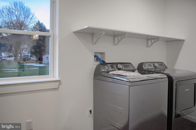 laundry area featuring washing machine and clothes dryer