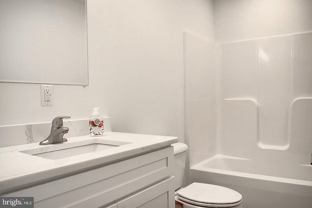 full bathroom with vanity, shower / bath combination, and toilet