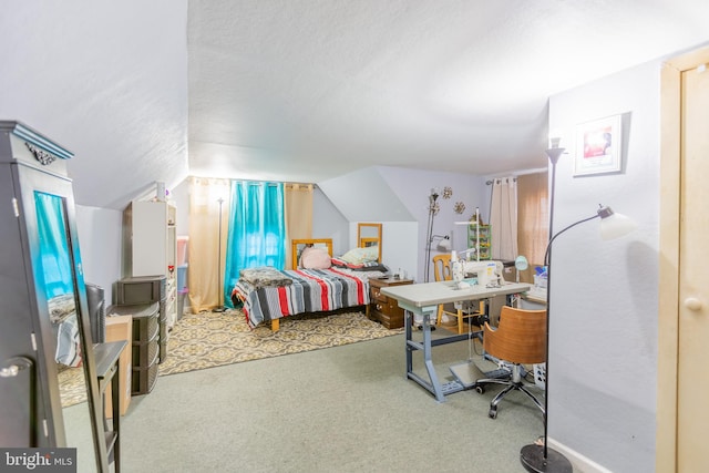 bedroom featuring carpet flooring, lofted ceiling, and a textured ceiling