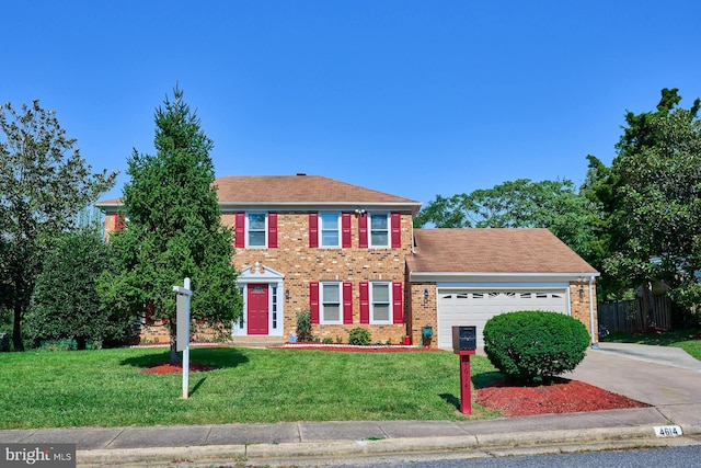 colonial home with a garage and a front lawn