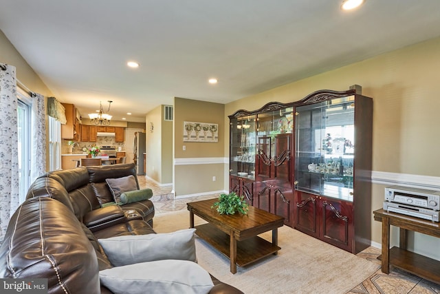 living room with an inviting chandelier