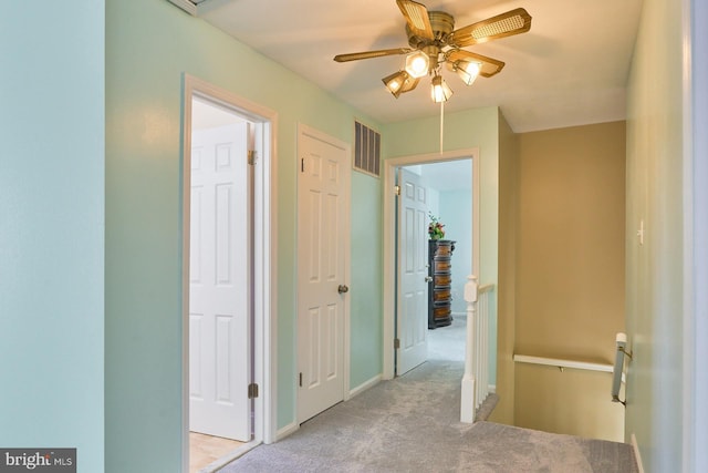 corridor with light colored carpet