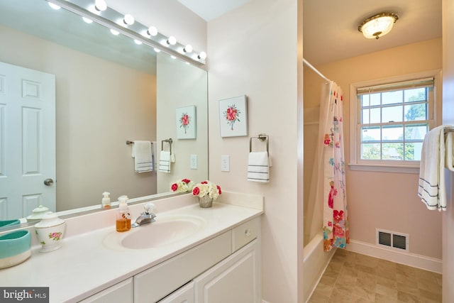 bathroom with vanity and shower / tub combo with curtain