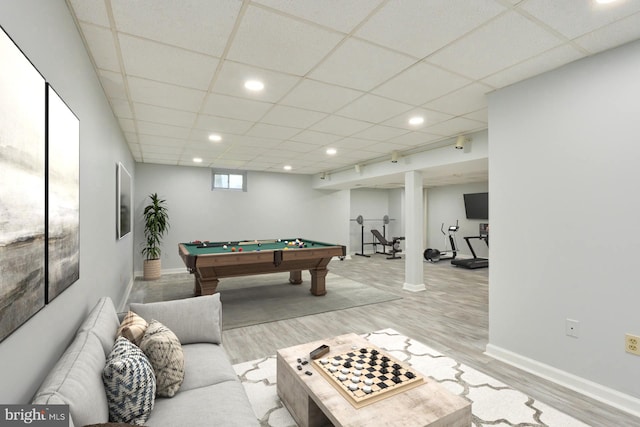 rec room featuring light wood-type flooring, a drop ceiling, and pool table