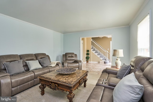 living room featuring a healthy amount of sunlight and ornamental molding