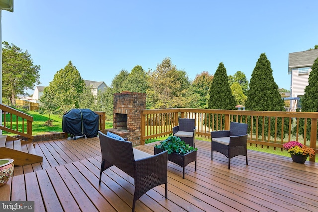 wooden terrace featuring a grill