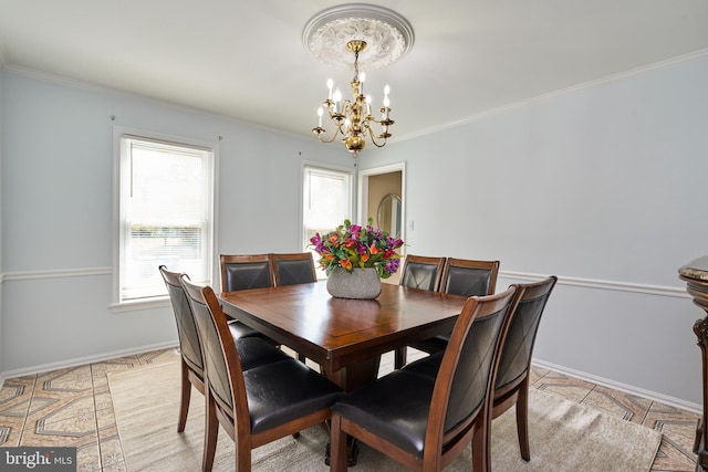 tiled dining space with crown molding, plenty of natural light, and an inviting chandelier