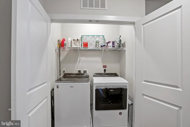 laundry area with washer and dryer