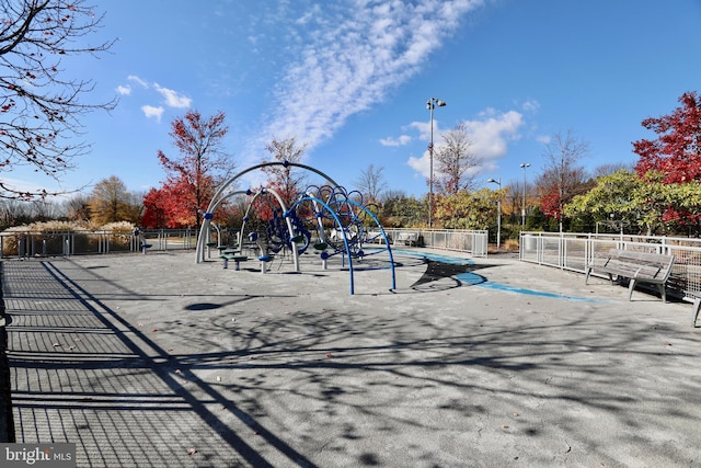 view of property's community with a playground