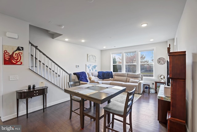 dining area featuring dark wood-type flooring