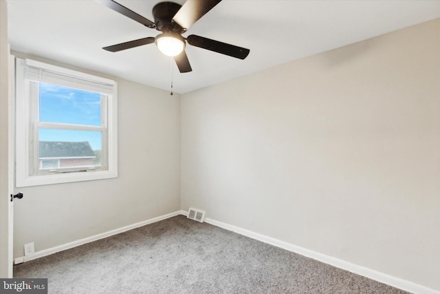 unfurnished room with carpet and ceiling fan