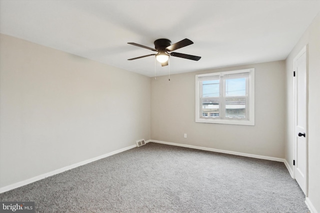 unfurnished room with carpet and ceiling fan