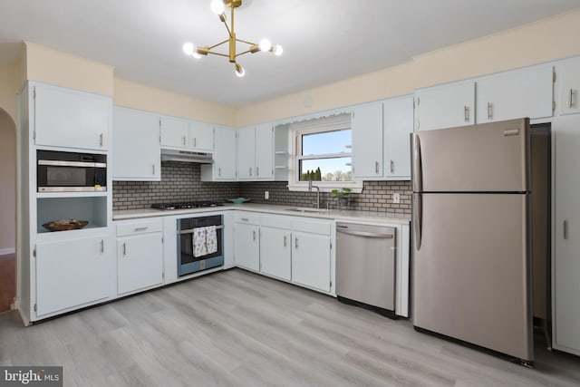 kitchen with white cabinetry, sink, appliances with stainless steel finishes, and light hardwood / wood-style flooring