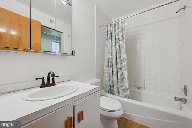 full bathroom with toilet, tile patterned floors, shower / bath combination with curtain, and vanity