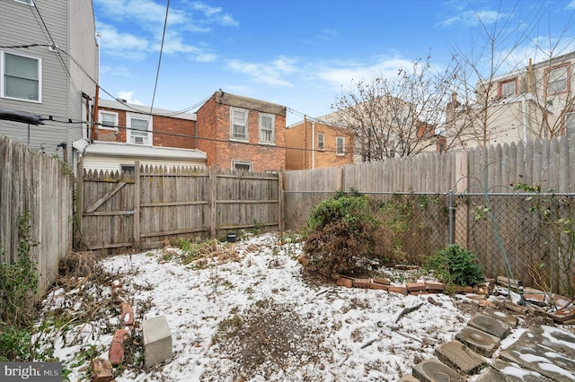 view of yard layered in snow