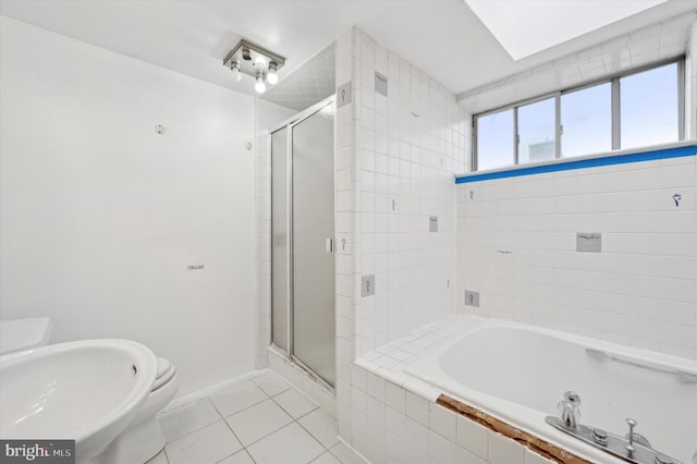 full bathroom featuring toilet, shower with separate bathtub, tile patterned floors, and sink