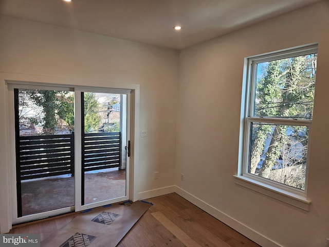 doorway to outside with hardwood / wood-style flooring