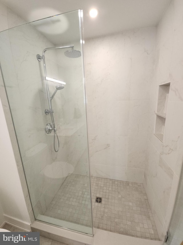 full bathroom with a shower stall