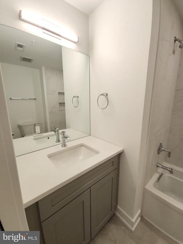 full bath featuring shower / tub combination, vanity, visible vents, and baseboards