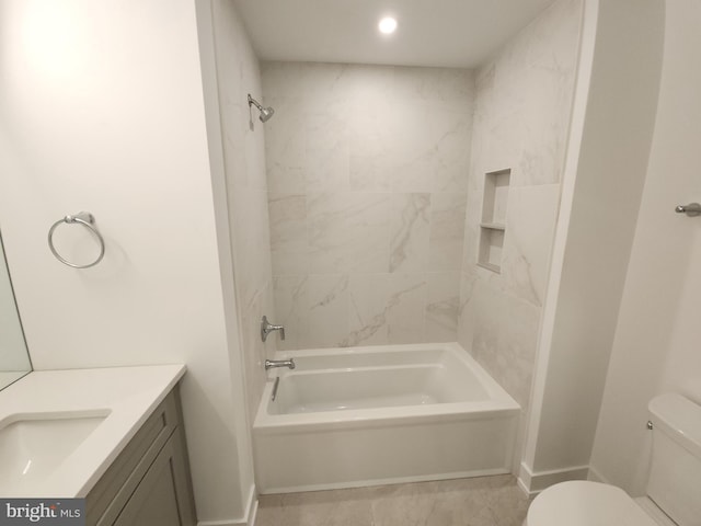 bathroom featuring shower / washtub combination, baseboards, vanity, and toilet