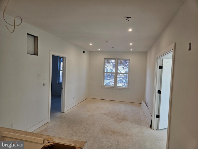 spare room with recessed lighting