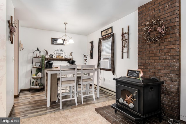 carpeted dining area featuring cooling unit and a notable chandelier